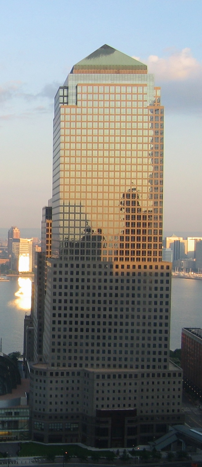 Three World Financial Center, the tower at 200 Vesey Street in Lower Manhattan that American Express gives as its principal office address, in evening light in July 2006 with the Hudson River behind i