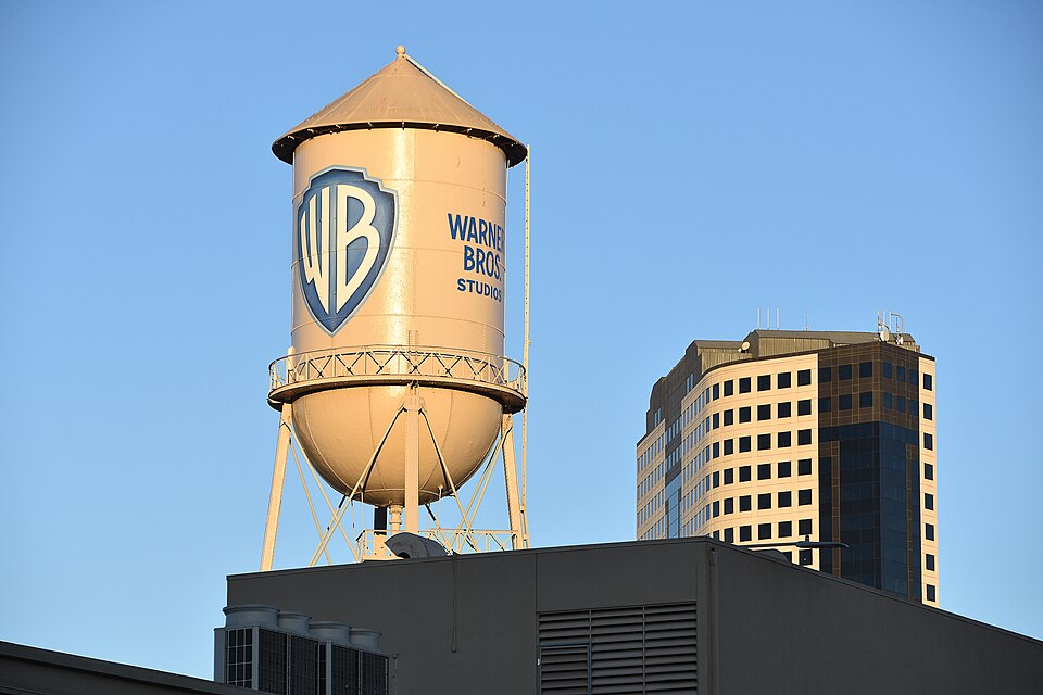 The Warner Bros. Studios water tower, painted with the WB shield, above a studio building in Burbank, California, in November 2020