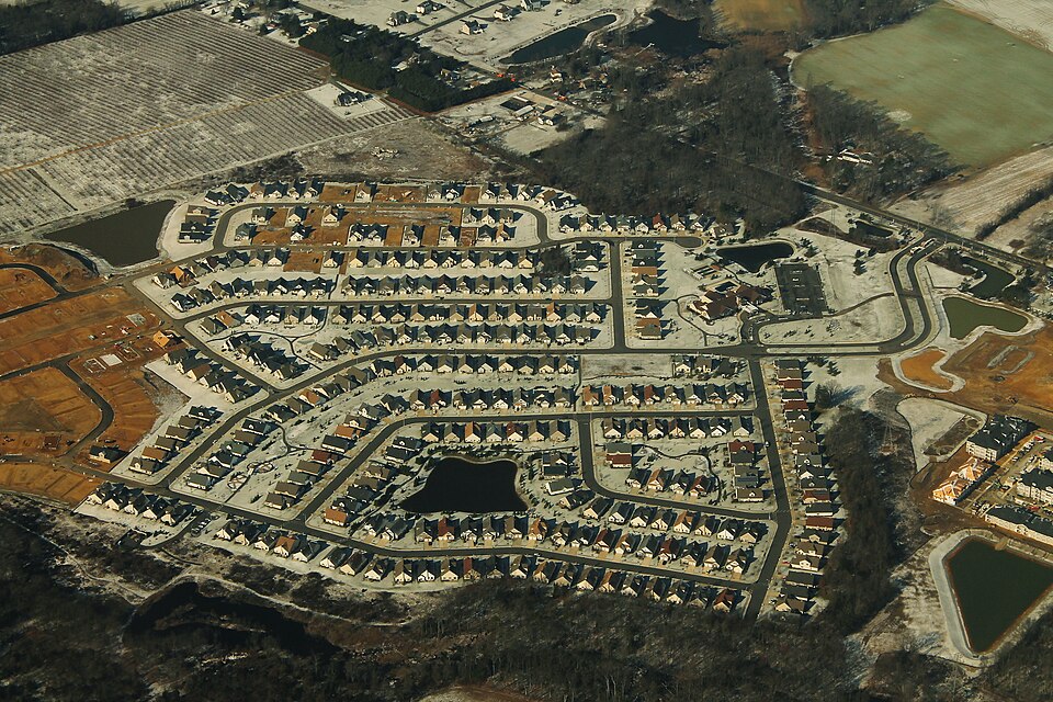 A housing development under construction in central New Jersey, seen from the air in January 2016, finished streets on one side and cleared lots on the other
