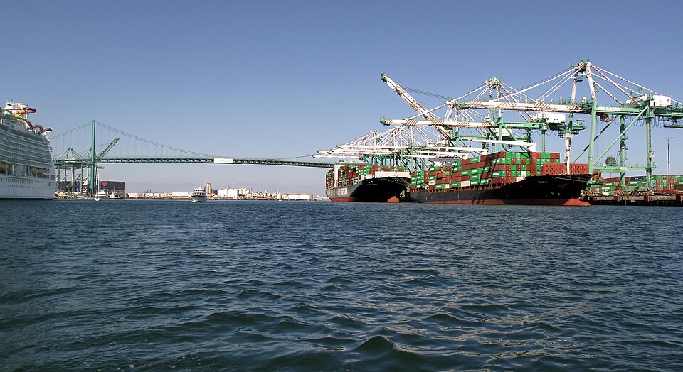 Container ships at the Port of Los Angeles in September 2021, one being unloaded at the right